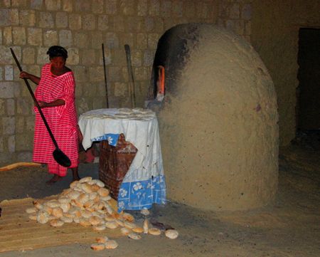 Woman preparing bread a dawn